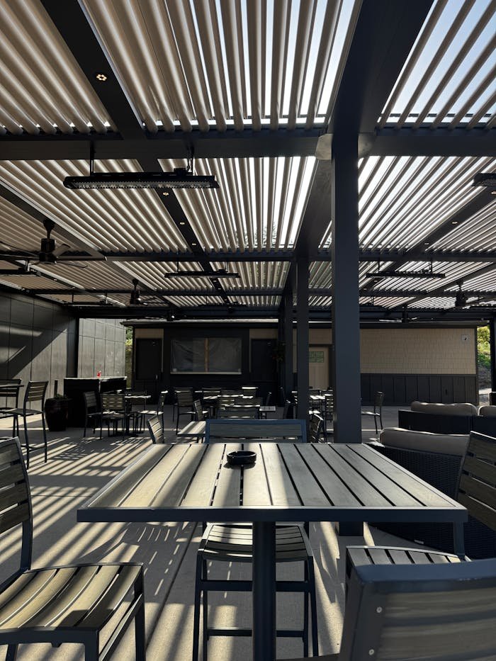 modern-outdoor-patio-with-metal-furniture-and-pergola-33993508